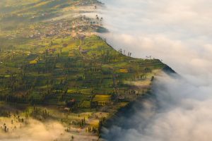 Clouds spilling over cliff