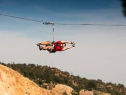 Image of a person on a zipline with Adventures Out West