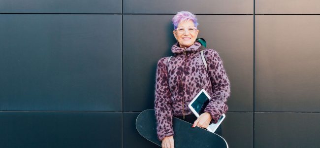 Trendy grandmother with skateboard