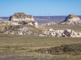 Two buttes poking up out of the grasslands of eastern Colorado.