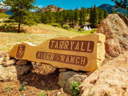 Image of a carved boulder with the logo for Tarryall River Ranch in Lake George, Colorado