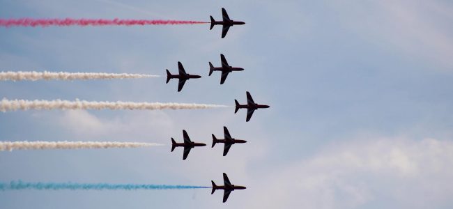 The Royal Air Force Aerobatic Team, the Red Arrows, in formation at Bournemouth Air Show 2020. Photo by Trey Musk on Unsplash