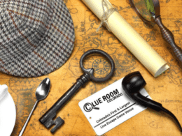 Image of a detective hat, pipe, magnifying glass, and key